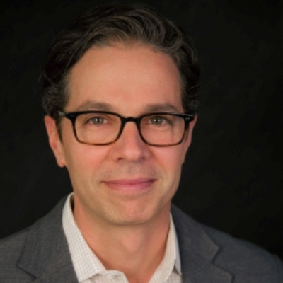 Headshot of Adam Sacks, white man with short dark hair in collared shirt and sport coat with black square glasses. Adam Sacks is the founder and President of Tourism Economics, an Oxford Economics company dedicated to understanding the relationship between travel and the economy. For more than two decades, Adam has worked with destinations, industry associations, and companies around the world in the areas of opportunity and risk assessments, policy analysis, and economic impact. He is an authority on measuring the economic impact of visitor activity and has analyzed the impacts of cruising, gaming, timeshare, hotels, new attractions and destination marketing. Adam's work has provided the foundation for billions of dollars in capital investment decisions by hotel companies, developers, and investors. Destination marketing organizations around the world rely on Tourism Economics data and scenario models to inform global marketing investment allocations. Adam also supports trade associations in the aviation, hotel, and broader travel arena with forecasts widely considered to be an industry standard. Adam's work has influenced critical government policies in the areas of travel facilitation, taxation, and tourism promotion initiatives. Adam regularly presents to corporate strategic planning teams on the threats and opportunities facing their businesses and is a member of the U.S. Department of Commerce, Travel & Tourism Advisory Board.